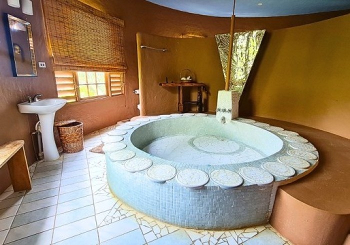 Couple enjoying private picnic on the cliffs at Great Huts romantic wellness escape